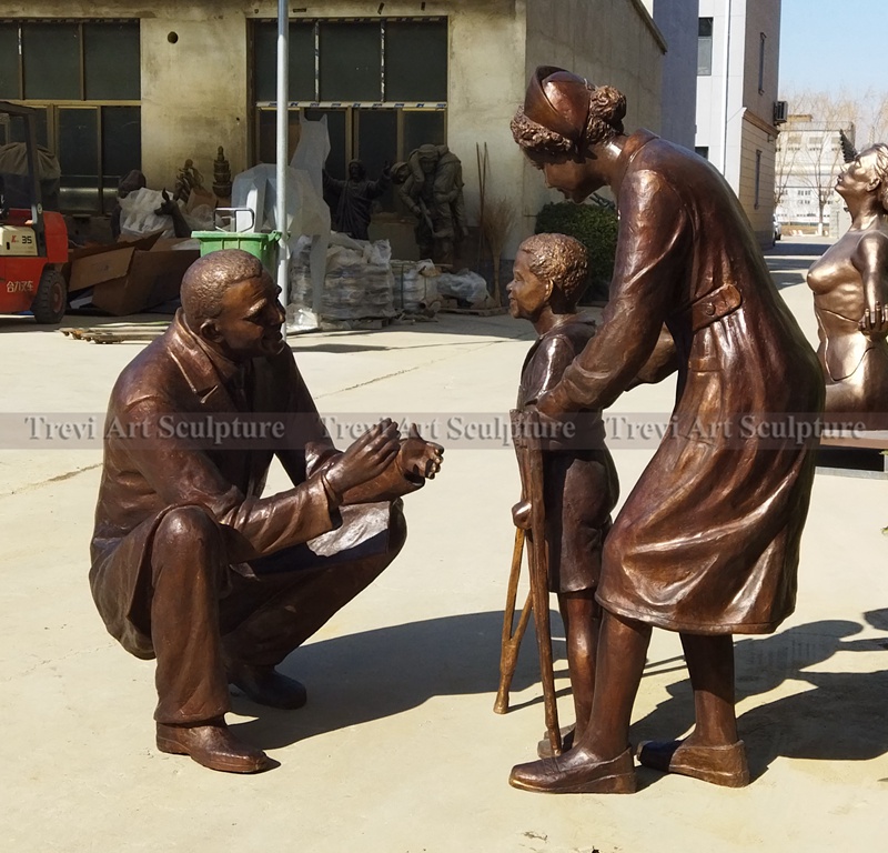 nurse and kid statue