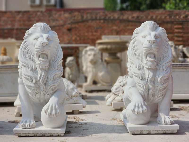 marble lion with ball sculpture