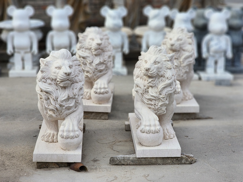 marble lion with ball statue