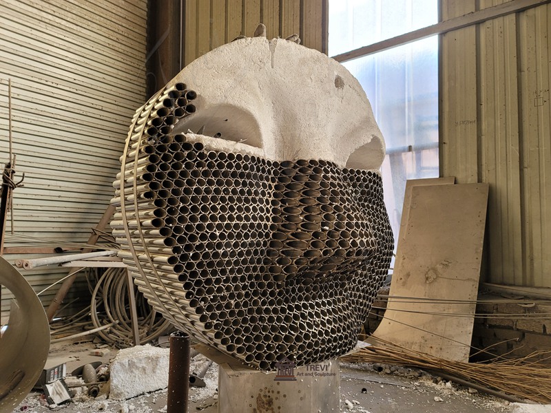 Metal Pipe face Sculpture