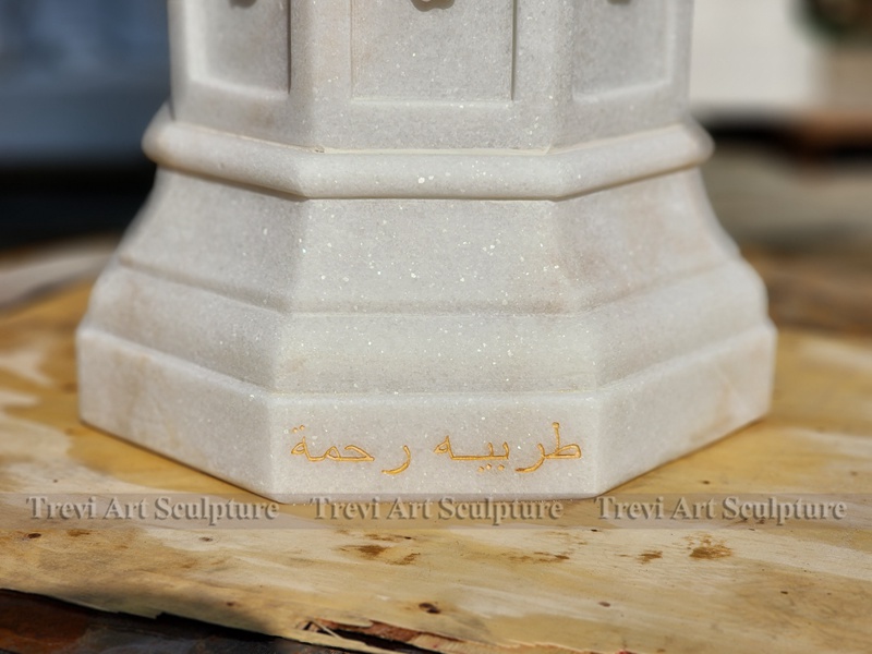 white octagonal baptismal font details