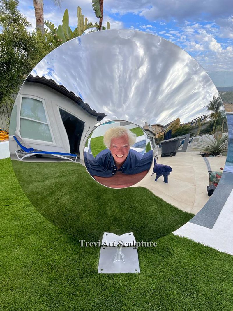 Mirror polished metal disc sculpture for sale