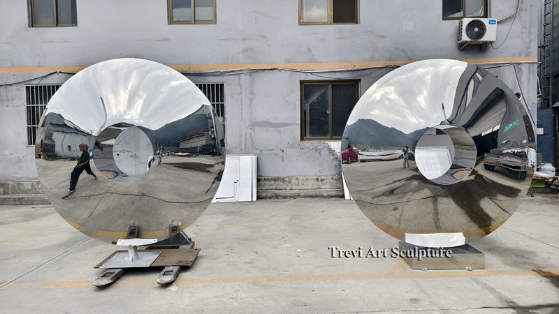 Mirror polished metal disc sculptures