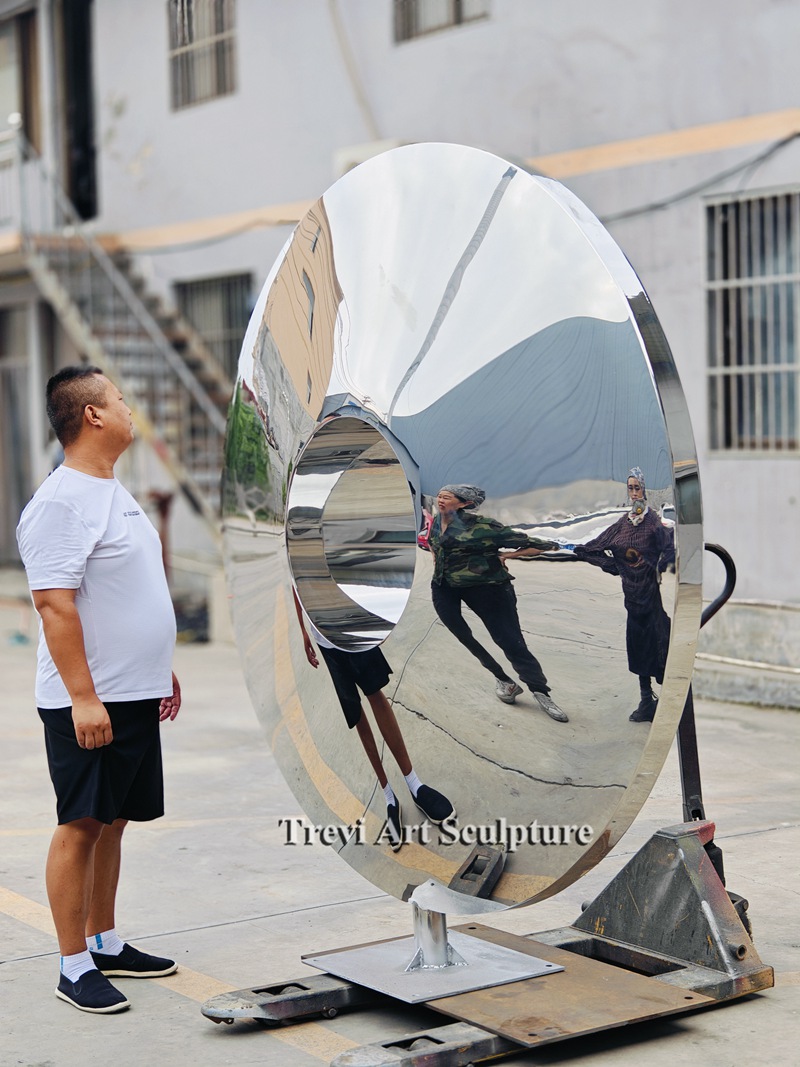 polished metal disc sculpture for garden