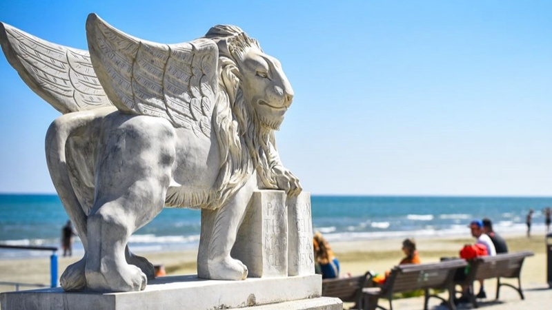 The statue of the Winged Lion of Venice (Lion of St Mark), located at the end of the Finikoudes promenade