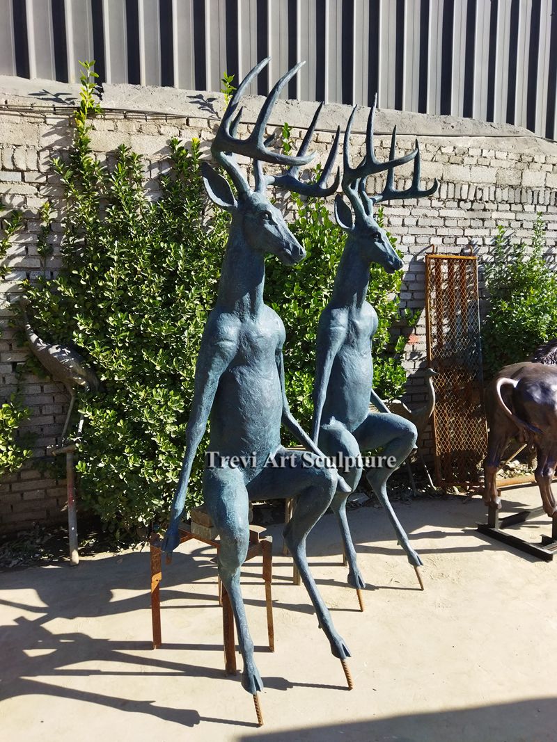 Life Size Scioto Lounge Deer Sitting Sculpture for sale