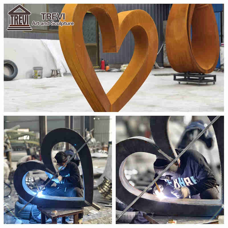 corten steel heart shaped sculptur in factory