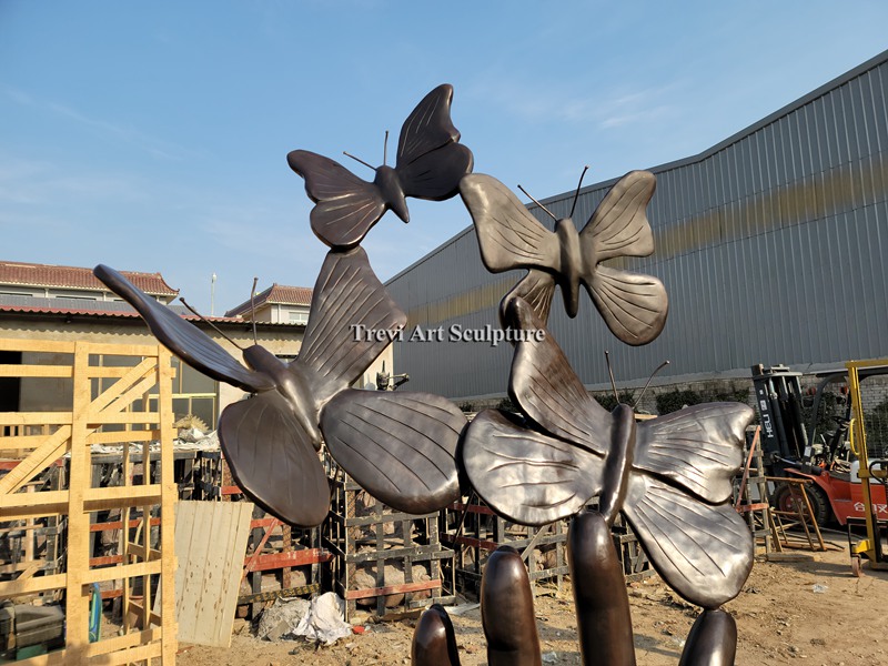hand Unleashing Butterflies bronze sculpture details