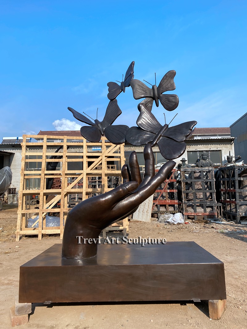 outdoor hand Unleashing Butterflies bronze sculpture