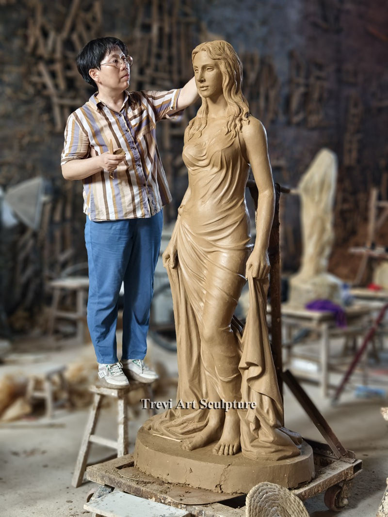 A highly realistic clay sculpture of a woman