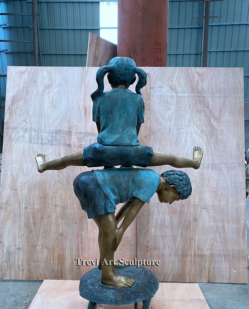 Outdoor kids playing leapfrog statue