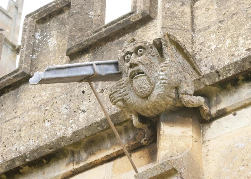 A goggle-eyed grotesque at St. Peter’s Church in Winchcombe, England