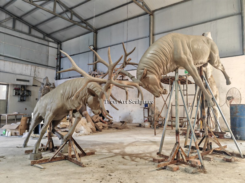 Clay prototype of two fighting bucks