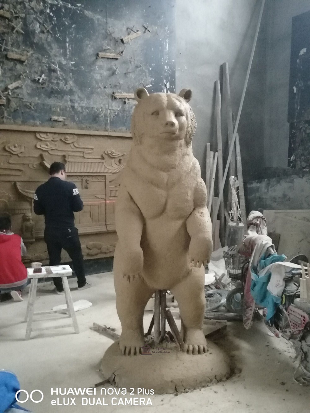 Clay model of a standing bear on hind legs