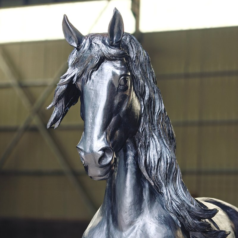 Detail view of a finished bronze horse statue
