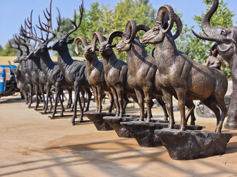 Bronze bighorn sheep with other wildlife sculptures at the workshop