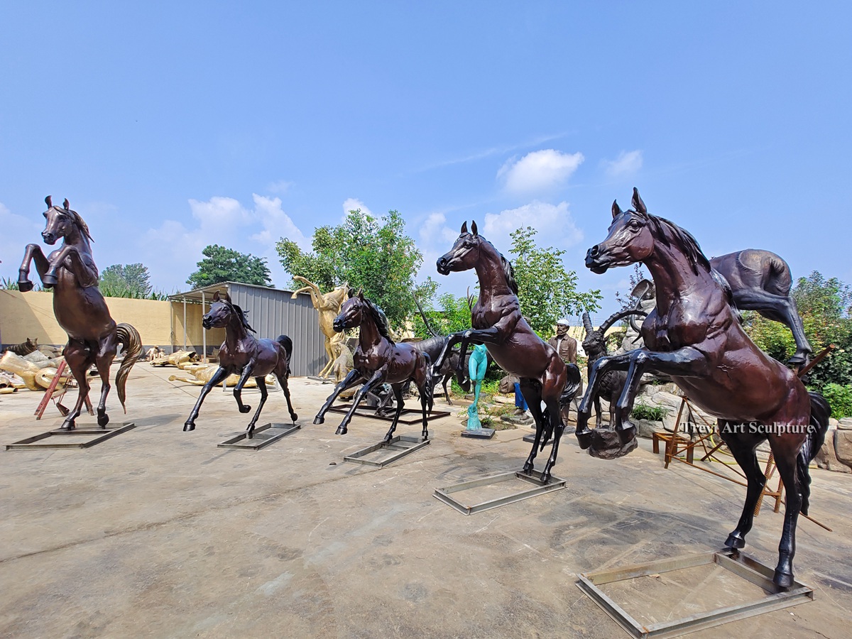 Several bronze horse sculptures displayed outside the Trevi foundry