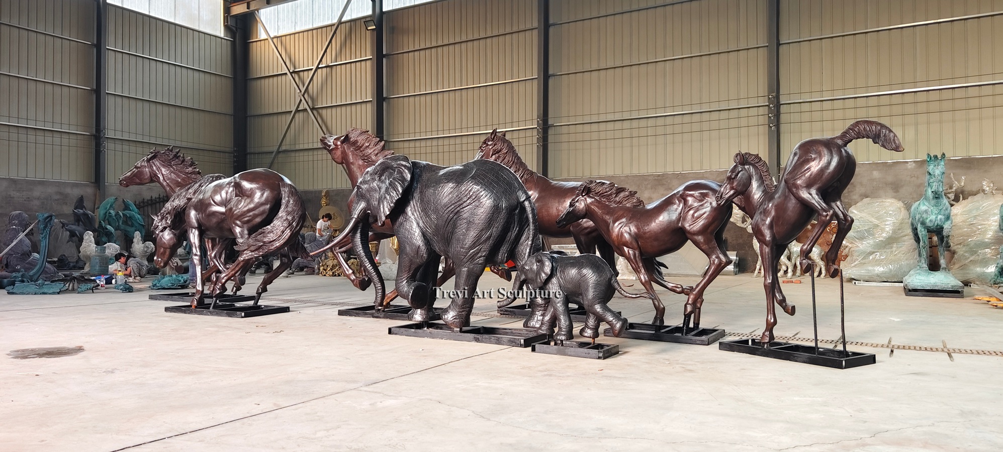 Finished horse sculptures and other bronze figures inside the Trevi foundry workshop